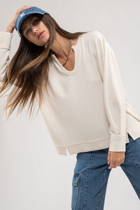 Evie Raw Edge Split Neck Long Sleeve Top: Cream