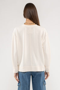 Evie Raw Edge Split Neck Long Sleeve Top: Cream