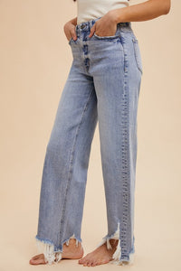 The Rebel Edge High-Rise Jeans – Stretch Denim with Asymmetrical Distressed Hem