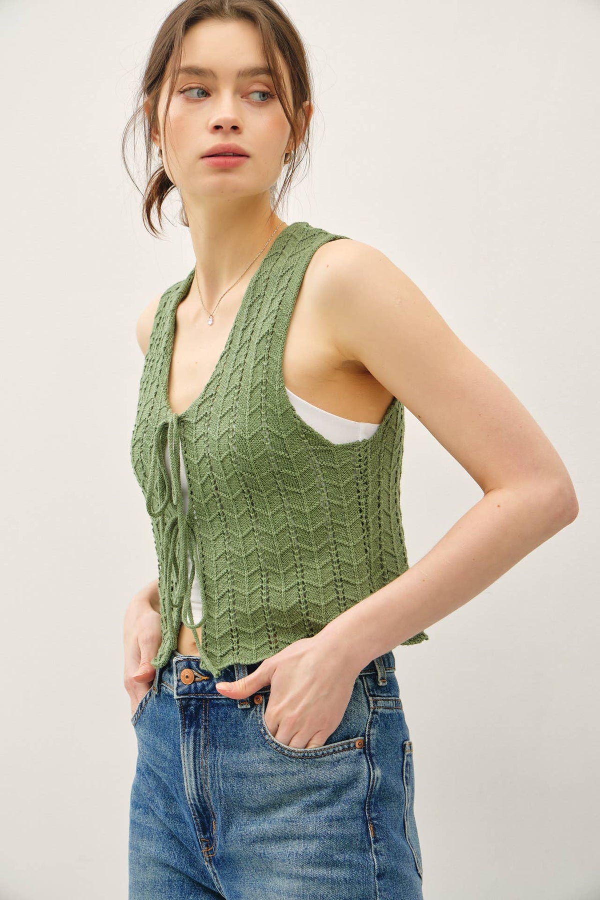 The Bellamy Knit Tie Vest: Soft Pine – Soft Sweater Vest with Wavy Hem Detail for Women